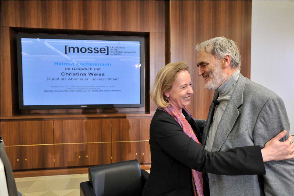 Lachenmann and Weiss embrace after their conversation