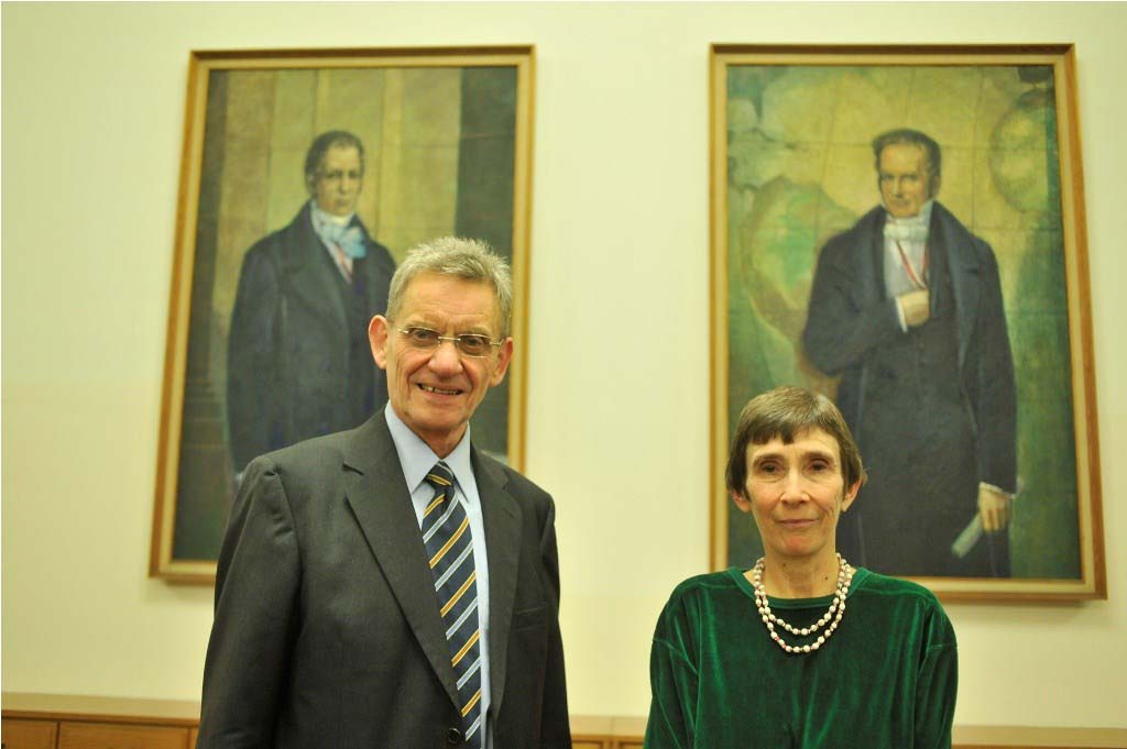 Romaine and Dietrich pose in front of the portraits of the Humboldt brothers