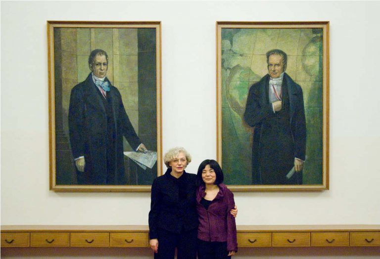 Tawada and Weigel in front of the portraits of the Humboldt brothers