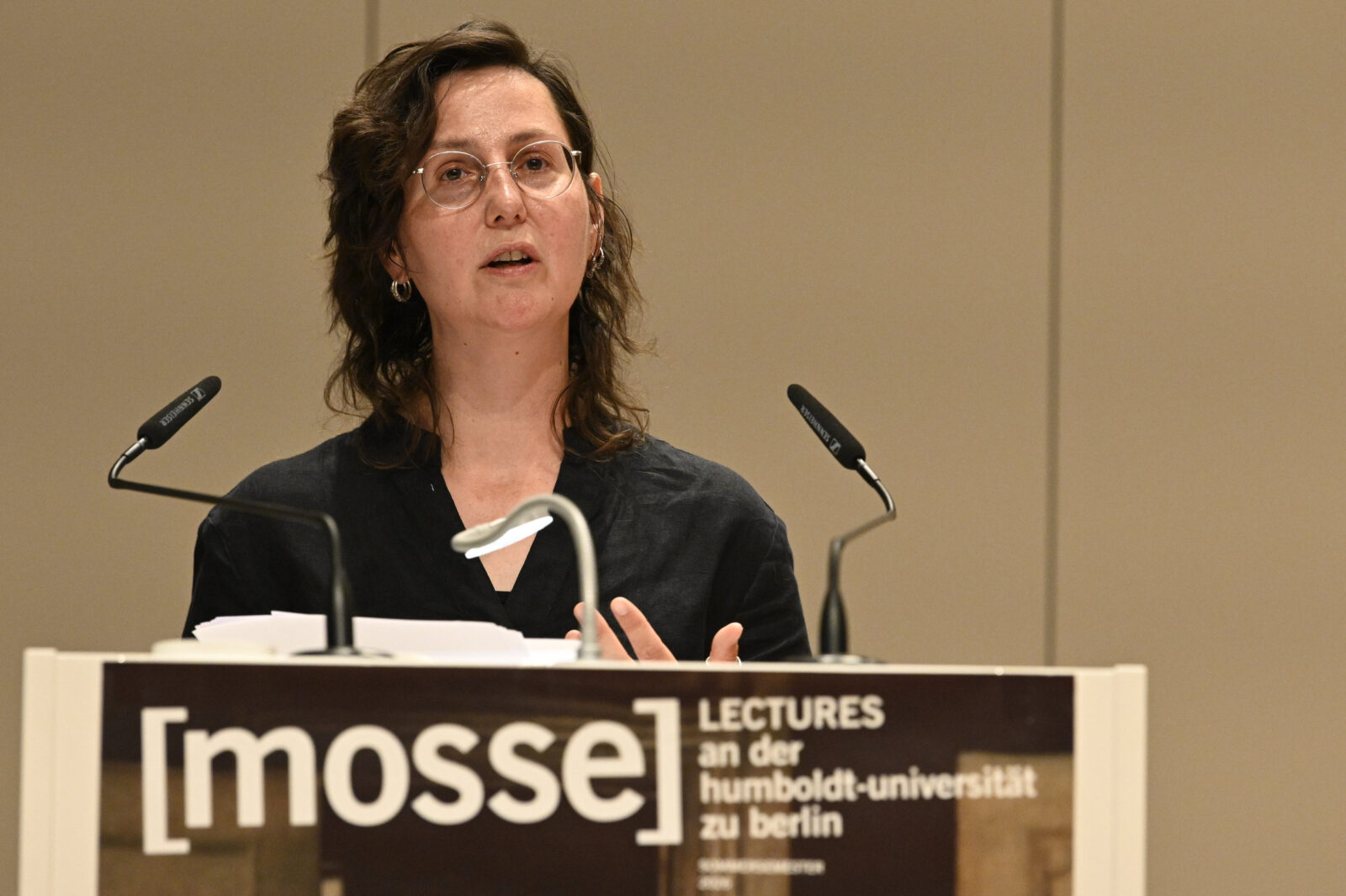 Govrin speaks at the podium